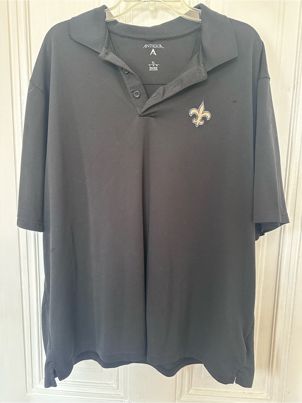 Antigua Black Polo with Gold Fleur-de-Lis Chest Emblem